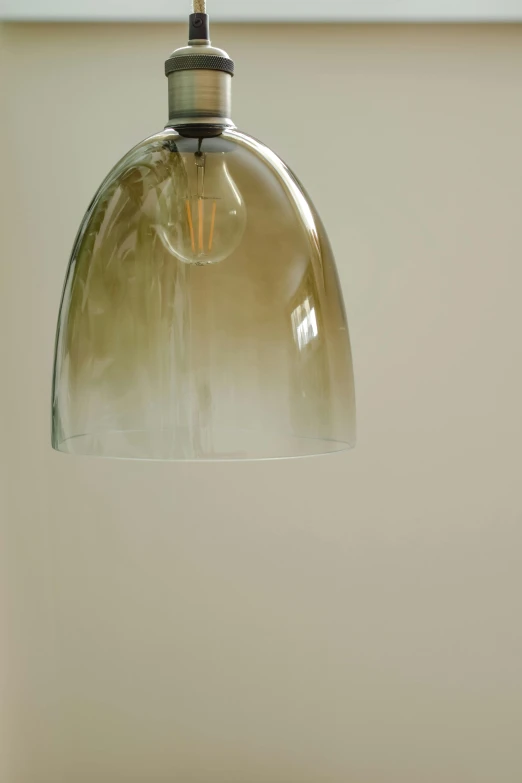 a close up of a light hanging from a ceiling, inspired by Richard Wilson, light and space, muted brown, soft green natural light, glass, handcrafted