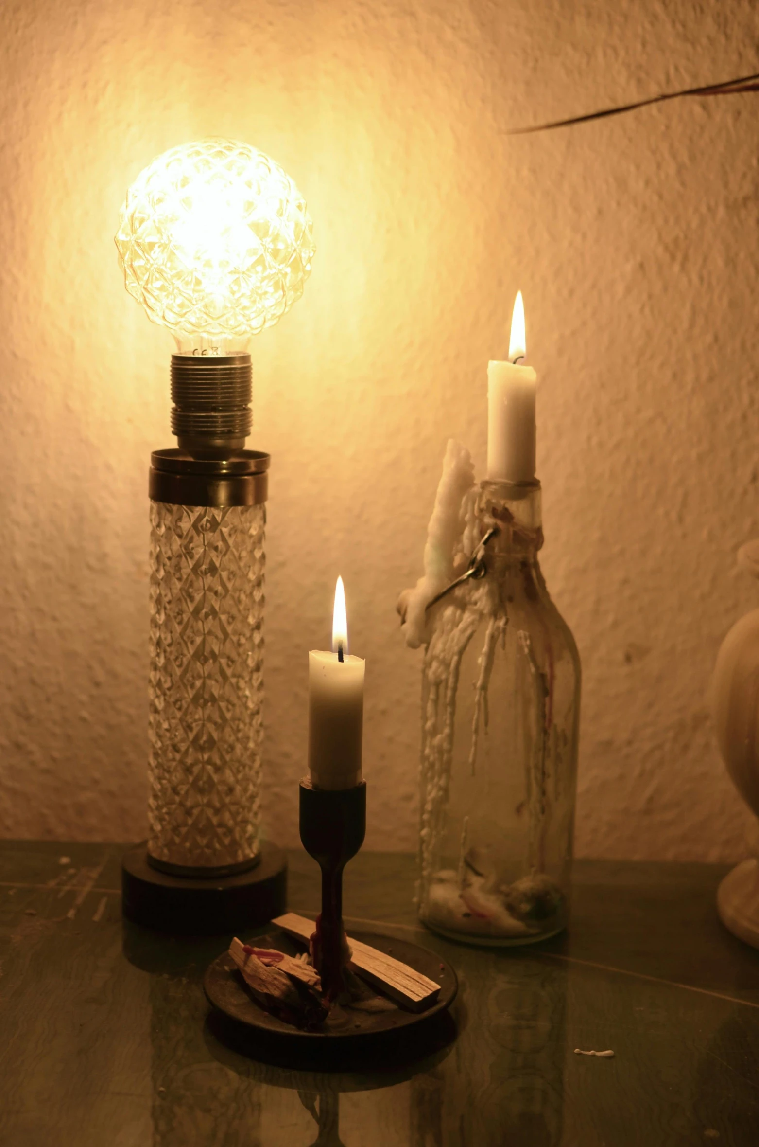 a couple of candles sitting on top of a table, lightning in a bottle, home display, softly - lit, mid - shot