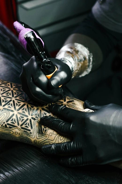 a man getting a tattoo on his arm, a tattoo, trending on pexels, process art, sacred geometry, black stencil, intricate metal, synthetic bio skin