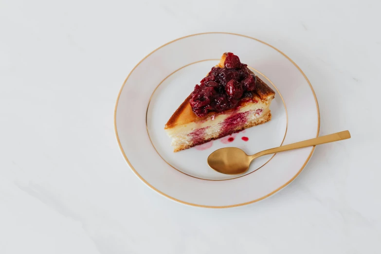 a piece of cheesecake on a plate with a spoon, inspired by Richmond Barthé, baroque, raspberry, front facing, listing image, angled