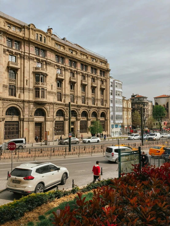 a street filled with lots of traffic next to tall buildings, pexels contest winner, art nouveau, istanbul, neoclassical police station, freddy mamani silvestre facade, square