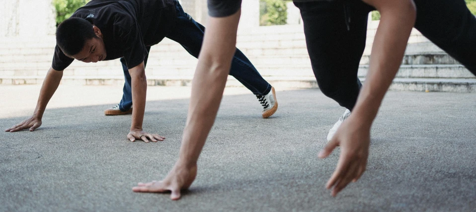 a group of people doing push ups in the street, pexels contest winner, feet and hands, profile image, background image, no watermarks