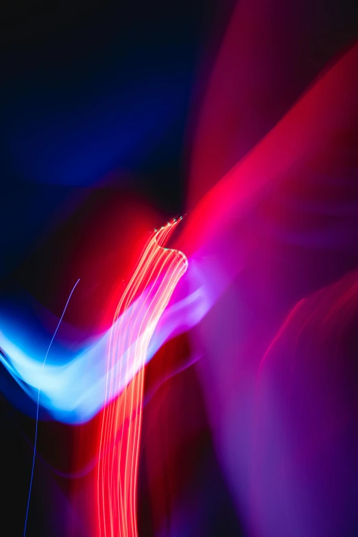 a blurry photo of a red and blue light, pexels, lyrical abstraction, curved lines, light dispersion, red and white neon, purple light