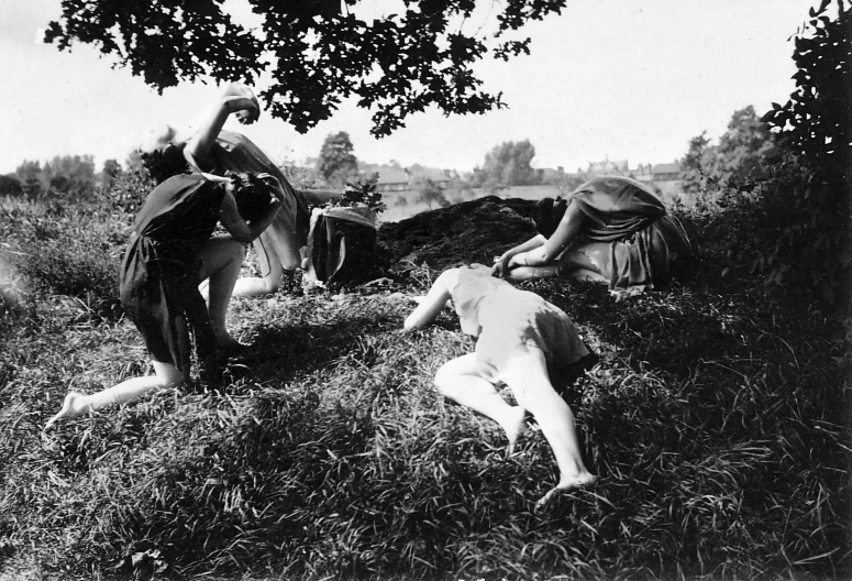 a black and white photo of two people in a field, by Méret Oppenheim, bloody scene, girls resting, medieval photograph, working out in the field