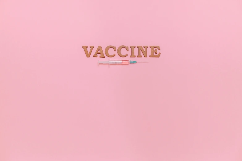 the word vaccine written in gold foil on a pink background, by Damien Hirst, simin stalenhag, made of cotton candy, syringe, clemens ascher