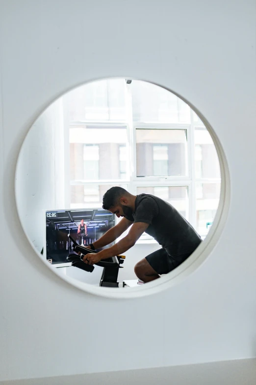 a man that is standing in front of a mirror, circular windows, working out, in front of a computer, profile image