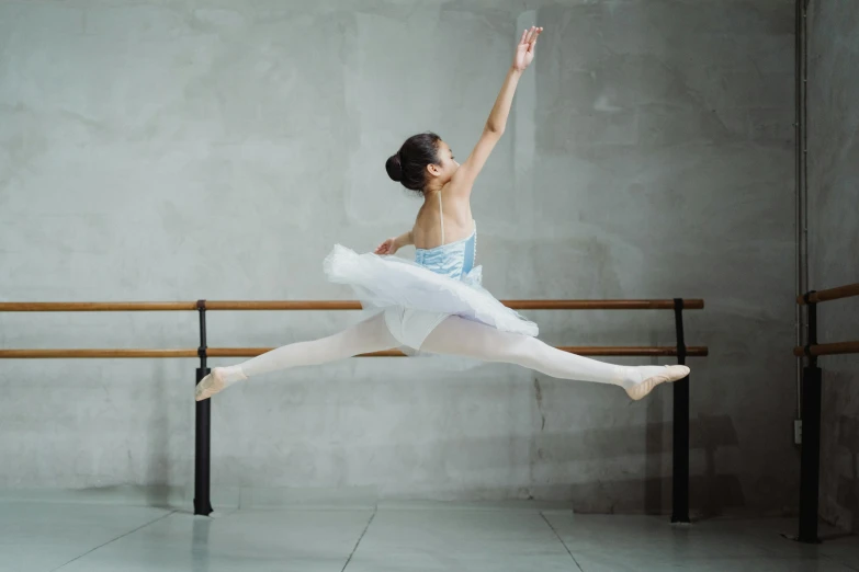 a woman that is jumping in the air, by Elizabeth Polunin, pexels contest winner, arabesque, dressed as a ballerina, square, yanjun chengt, 15081959 21121991 01012000 4k