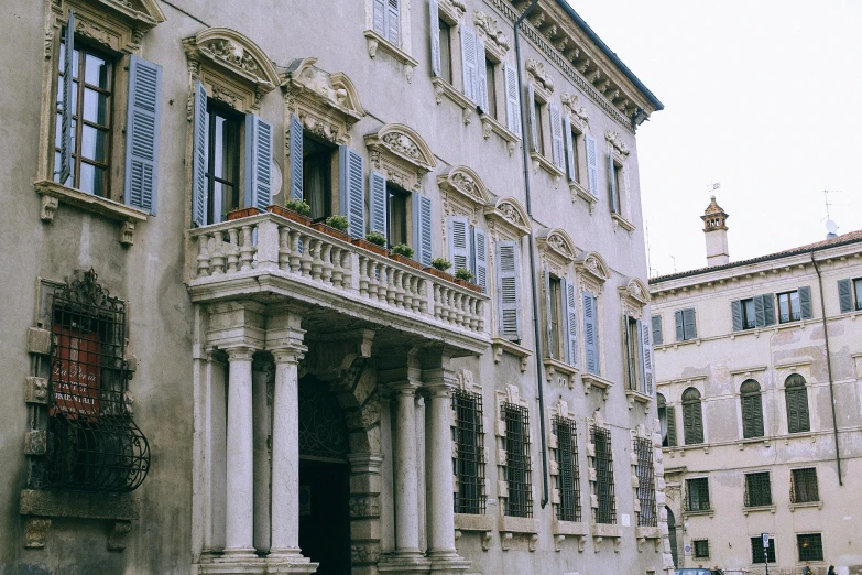 a car is parked in front of a building, inspired by Giovanni Battista Innocenzo Colombo, pexels contest winner, neoclassicism, profile image, preserved historical, balcony, youtube thumbnail