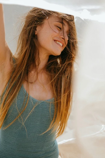 a woman holding a surfboard over her head, trending on pexels, renaissance, wearing a camisole, smiling softly, brown colored long hair, wearing : tanktop