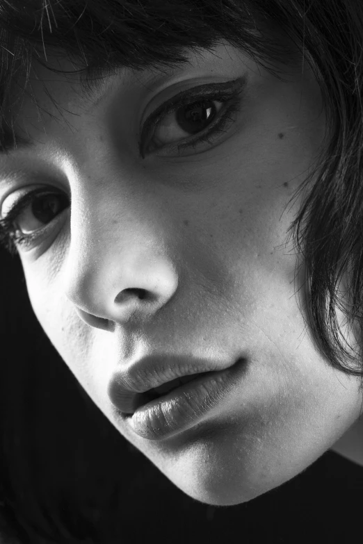 a black and white photo of a woman, inspired by irakli nadar, hyperrealism, finn wolfhard, close-up photograph, [ realistic photography ], [ [ hyperrealistic ] ]