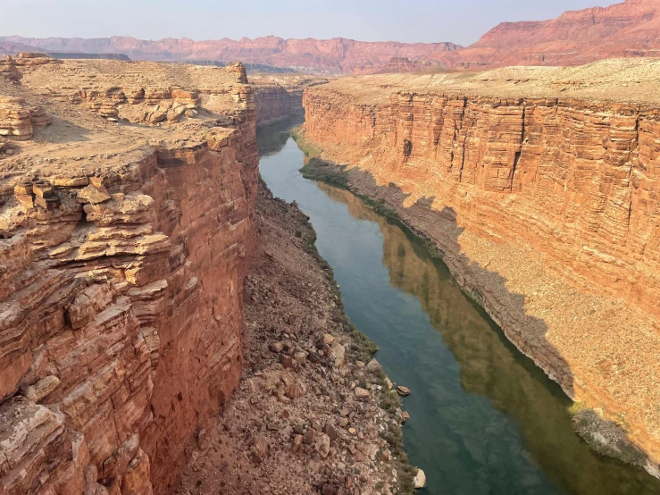 a river running through the middle of a canyon, by Emma Lampert Cooper, pexels contest winner, hurufiyya, grand canyon in background, erosion algorithm landscape, panels, 2000s photo