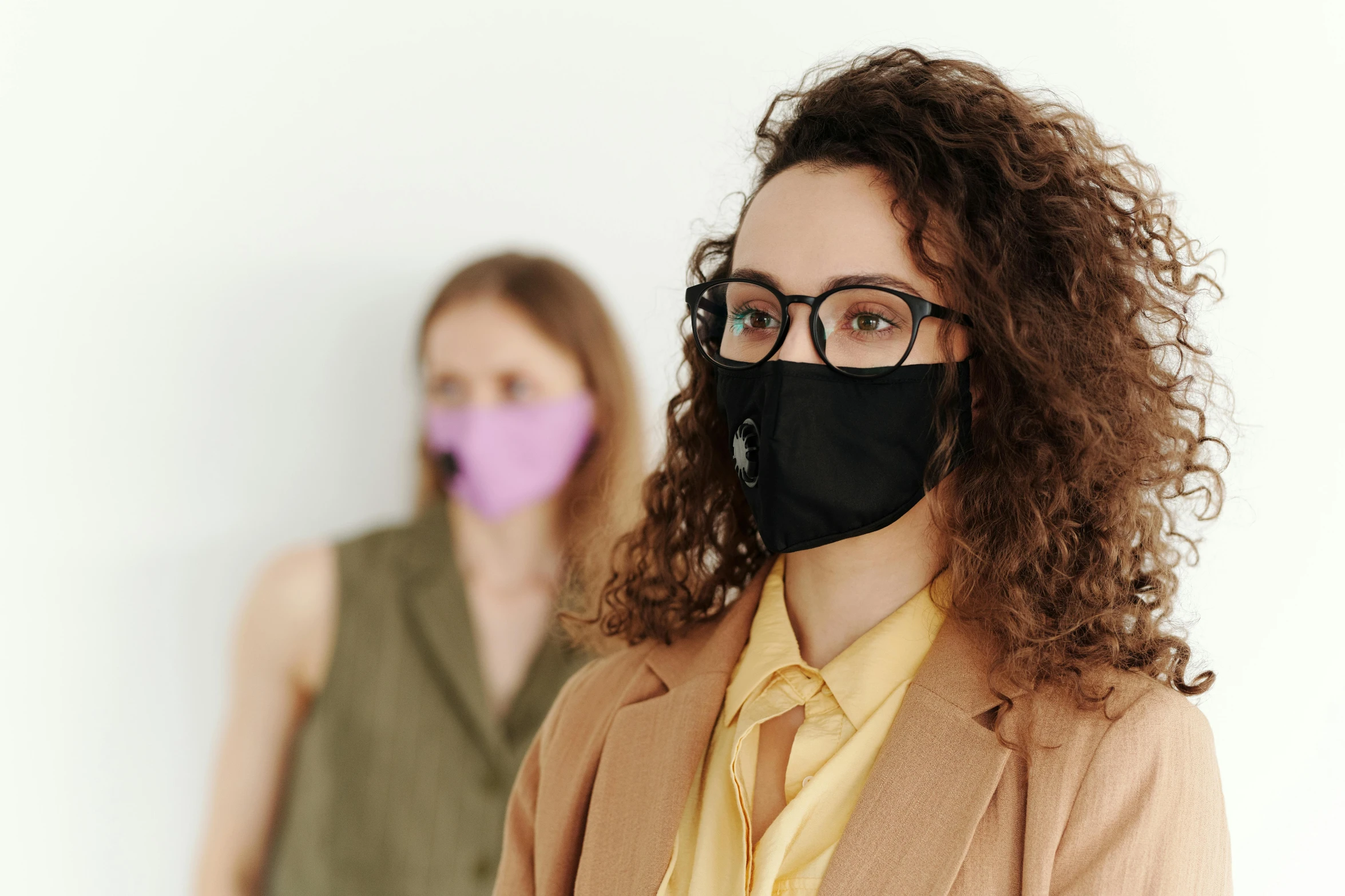 two women wearing masks standing next to each other, trending on pexels, glasses, avatar image, thumbnail, bottom angle