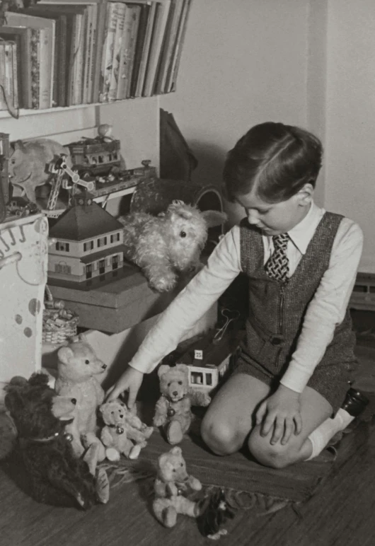 a black and white photo of a boy playing with teddy bears, bauhaus, postman pat, a handsome, joyce ballantyne, archive photo