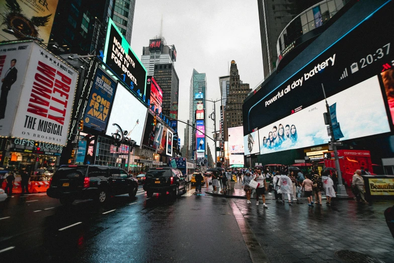 a city street filled with lots of traffic and tall buildings, a picture, electronic ads, rain aesthetic, time square, thumbnail