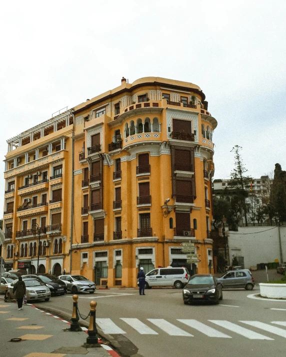 a large yellow building sitting on the side of a road, by Alejandro Obregón, art nouveau, gigapixel photo, talaat harb square cairo, gif, marbella