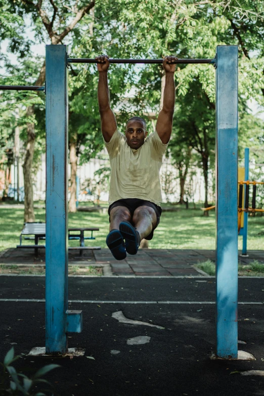 a man doing pull ups in a park, by Joze Ciuha, square, cinematic shot ar 9:16 -n 6 -g, “hyper realistic, outdoor