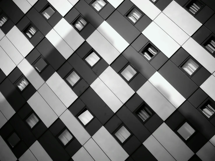 a black and white photo of a building, by Matthias Weischer, unsplash contest winner, squares, “diamonds, contrasting colours, hotel room
