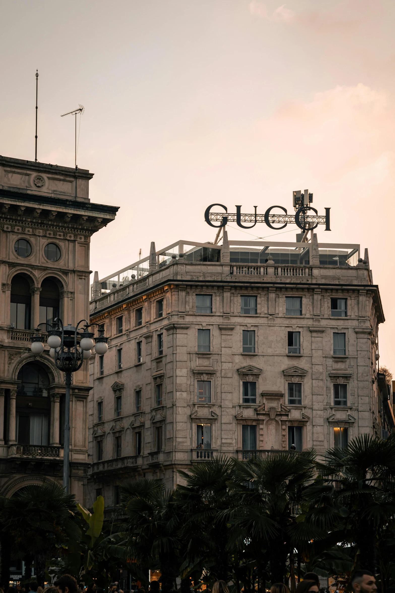 a large building with a sign on top of it, inspired by Alberto Sughi, unsplash contest winner, renaissance, gucci, hotel, square, neoclassical