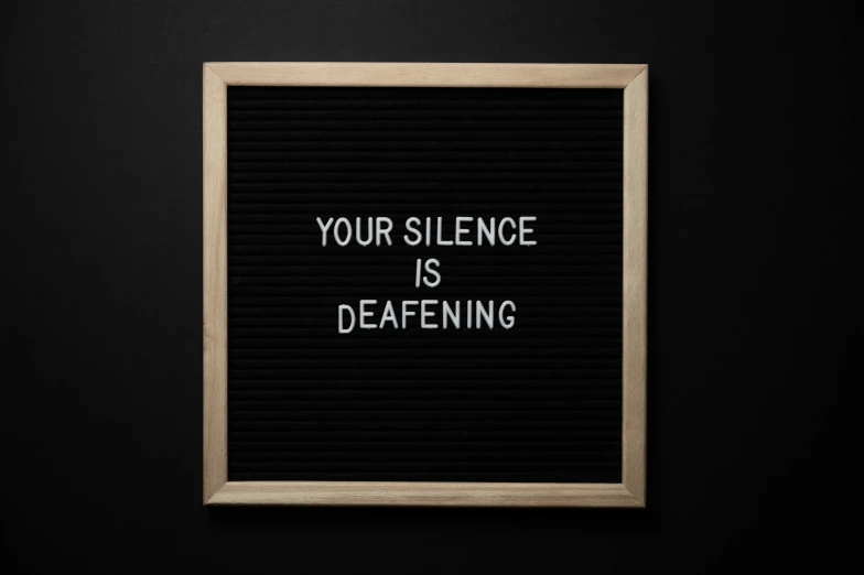 a letter board with the words your silence is deafening, trending on pexels, 1024x1024, automated defence platform, wood print, profile picture
