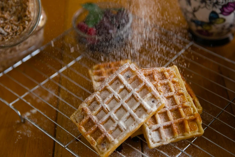 a couple of waffles sitting on top of a cooling rack, pexels, hurufiyya, pouring, square, close up of iwakura lain, background image