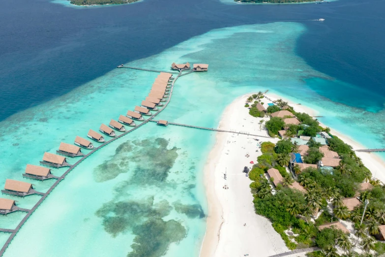 an aerial view of a beach resort in the middle of the ocean, pexels contest winner, hurufiyya, with walkways, profile image, brown, turquoise water