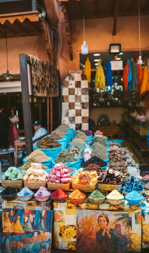 a market filled with lots of different types of food, inspired by Alberto Morrocco, trending on unsplash, square, moroccan city, mauve and cinnabar and cyan, official store photo