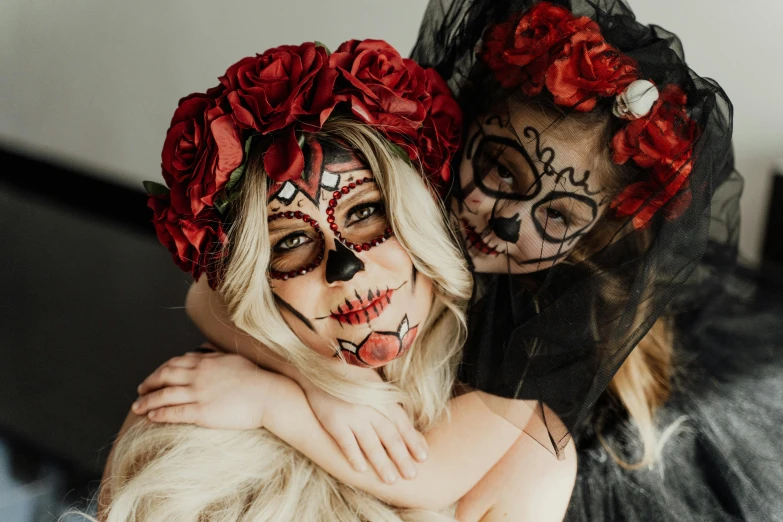 two women in day of the dead costumes hugging each other, by Emma Andijewska, trending on pexels, flatlay, rose crown, kids, rectangle