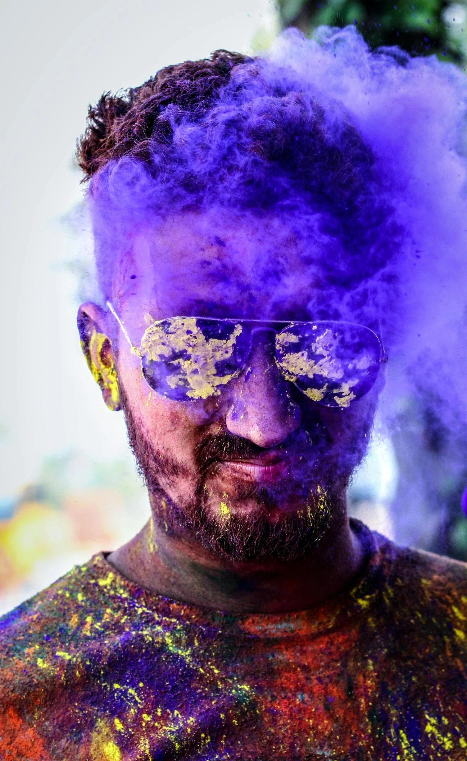 a man with purple powder on his face, a colorized photo, pexels contest winner, color field, with mirrorshades sunglasses, roshan, bearded, discord profile picture