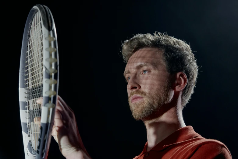 a man holding a tennis racquet in his hand, inspired by Hans Mertens, pexels contest winner, sharp focus cinematic lighting, avatar image, eye - level medium shot, tom hiddleston