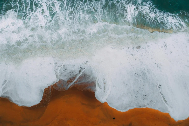 an aerial view of a large body of water, pexels contest winner, ocean spray, white and orange, oceanside, stylized photo