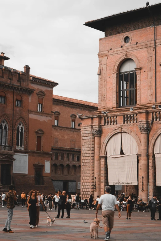 a group of people standing in front of a building, inspired by Giovanni Battista Innocenzo Colombo, pexels contest winner, renaissance, brick building, seen from a distance, crowds, background image