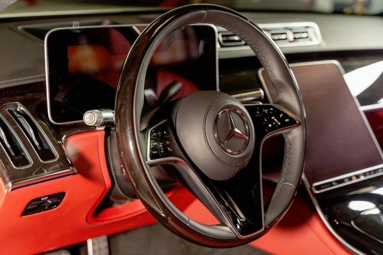 a close up of a steering wheel in a car, mercedes, gradient brown to red, thumbnail, taken with sony alpha 9