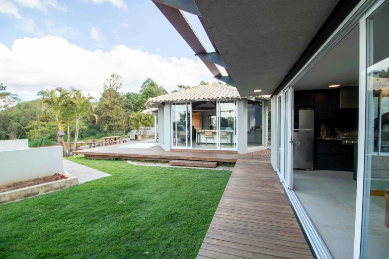 a view of a backyard from the outside of a house, inspired by Samuel Silva, unsplash, oscar niemeyer, avatar image, pristine clean design, arrendajo in avila pinewood