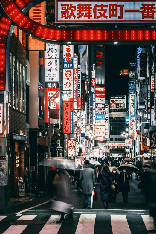 a group of people walking down a street at night, inspired by Kanō Hōgai, trending on unsplash, lots of signs and shops, square, ethnicity : japanese, city view