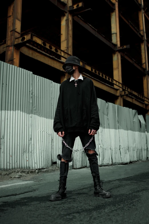 a man standing in the middle of a street, an album cover, inspired by Gang Hui-an, unsplash, renaissance, techwear fashion, a black choker, fullbody view, androgyny