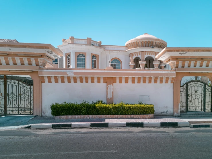 a large white building sitting on the side of a road, by Ahmed Yacoubi, pexels contest winner, art nouveau, inter dimensional villa, tanned ameera al taweel, front view 1 9 9 0, rounded roof