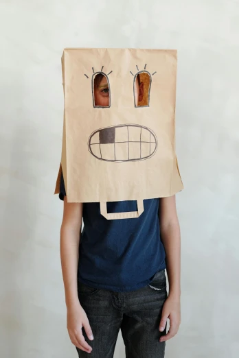 a boy with a paper bag on his head, inspired by Saul Steinberg, reddit contest winner, graffiti, official product photo, square face, ((robot)), teen boy