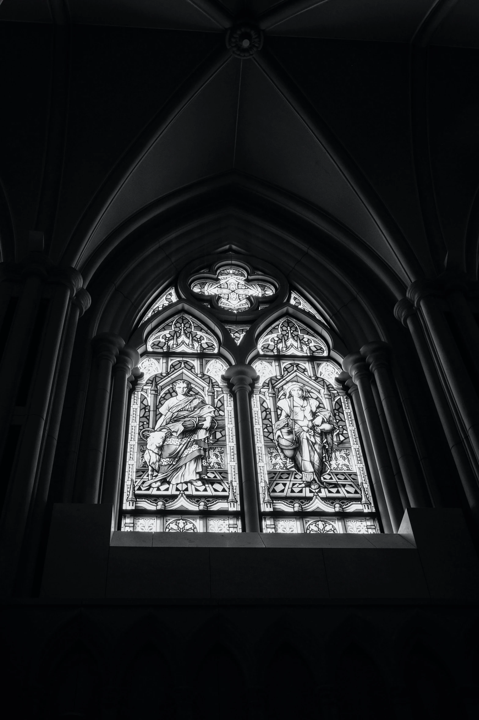 a black and white photo of a stained glass window, a black and white photo, by Jacob Toorenvliet, unsplash, gothic art, two, holy iconography, shot on hasselblad, glowing from inside