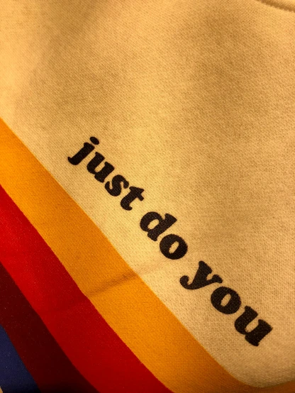 a sweatshirt with the words just do you written on it, by Jessie Alexandra Dick, unsplash, process art, lgbt flag, detail shot, akira yasuda, paul rand
