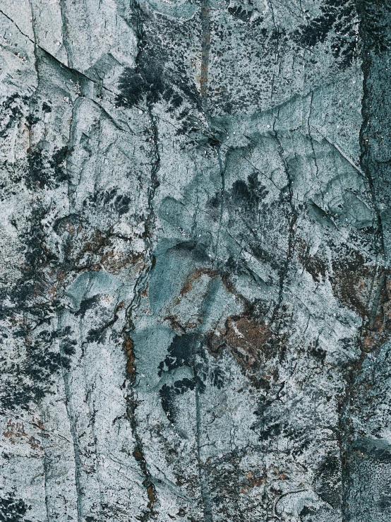 a man riding a snowboard down a snow covered slope, an ultrafine detailed painting, inspired by Per Kirkeby, unsplash, lyrical abstraction, tree bark texture, ((greenish blue tones)), ((rocks)), detail texture