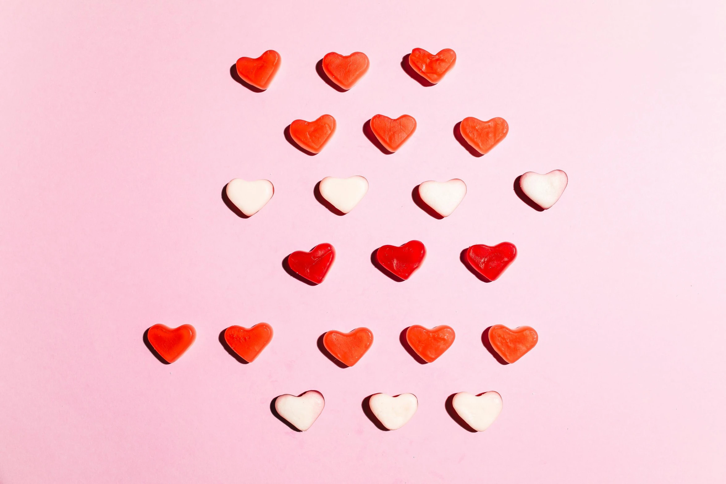 a lot of red and white hearts on a pink background, by Julia Pishtar, pexels, made of candy, shot on sony a 7, single, flattened