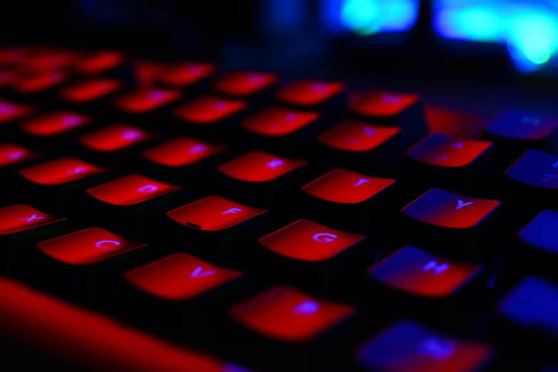 a close up of a keyboard with red and blue lights, a screenshot, by Adam Marczyński, pexels, computer art, instagram post, red color theme, multiple colors, profile picture 1024px