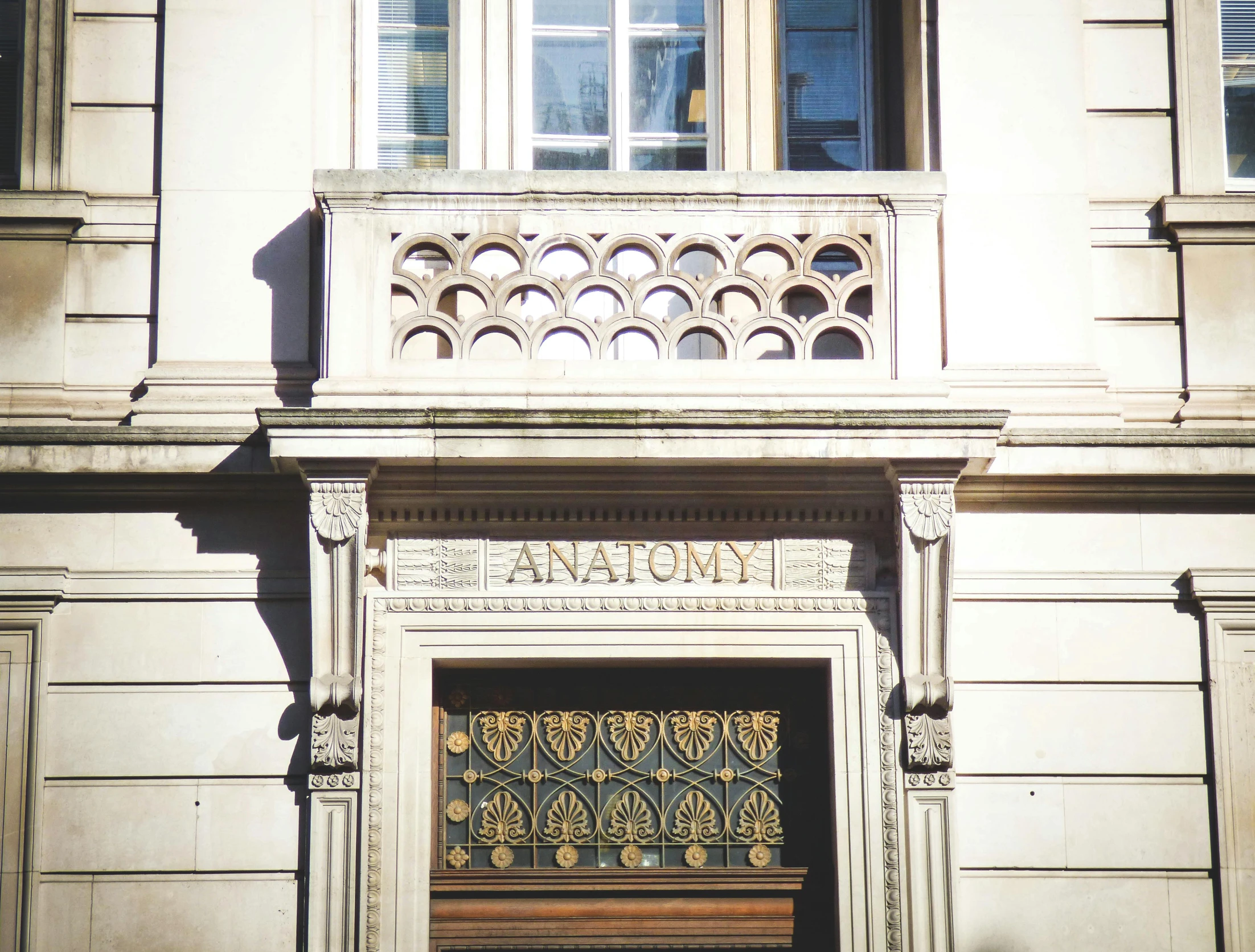 a building with a clock on the front of it, by Anna Findlay, instagram, art nouveau, medical anatomy, carved in white marble, private academy entrance, looking across the shoulder