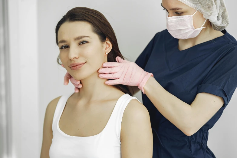 a woman getting her neck examined by a doctor, by Emma Andijewska, trending on pexels, renaissance, hand on cheek, square jaw-line, 2263539546], full body and face