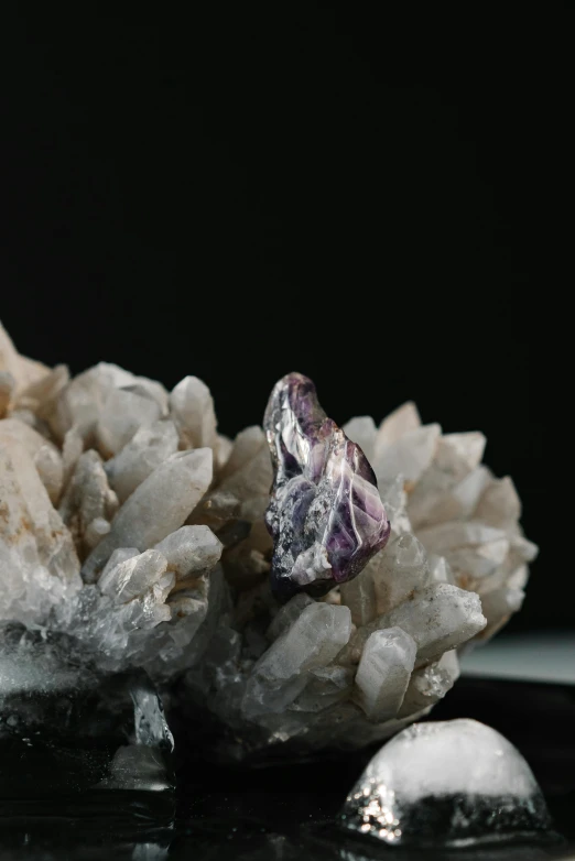 a cluster of crystals sitting on top of a table, a macro photograph, by artist, trending on unsplash, purple ancient antler deity, shot on sony a 7 iii, detailed product image, petite