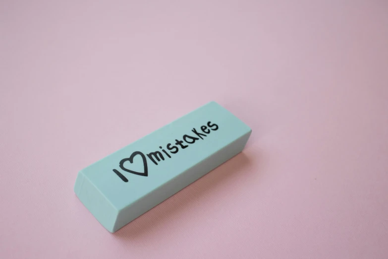 a blue erase sitting on top of a pink surface, an engraving, trending on pexels, broken hearts, building blocks, mikado, loveable guy