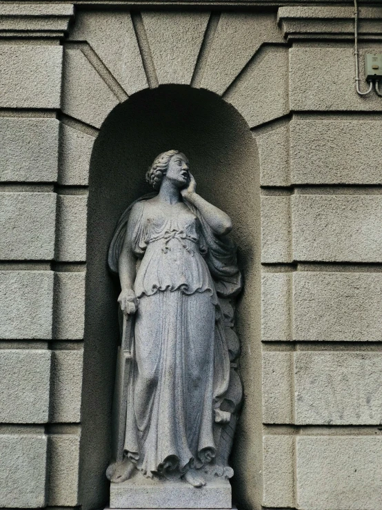 a statue of a woman on the side of a building, tomb, very aesthetically pleasing, grey, ( art nouveau )