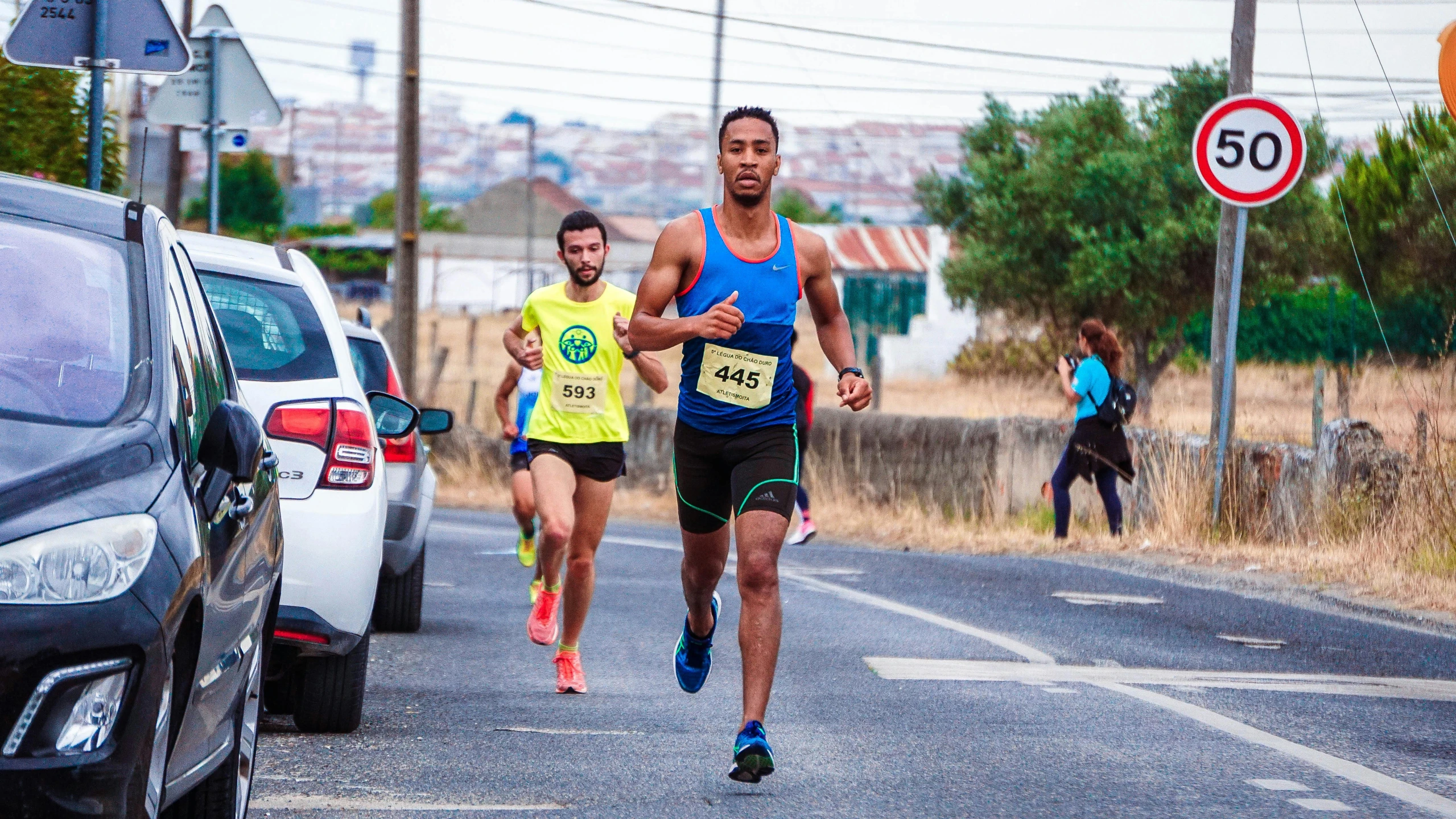 a group of people running down a street, by Nadir Afonso, 5k, sprinters in a race, servando lupini, avatar image