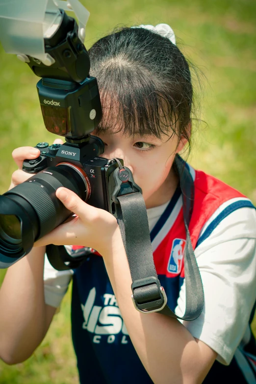 a girl taking a picture with a camera, inspired by Zhou Wenjing, sony a 7 siii, kids, tall shot, medium closeup