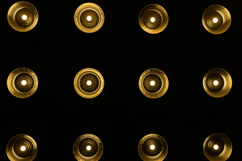 a number of lit candles in a dark room, by Jan Rustem, minimalism, view from below, brown holes, black and gold, panel